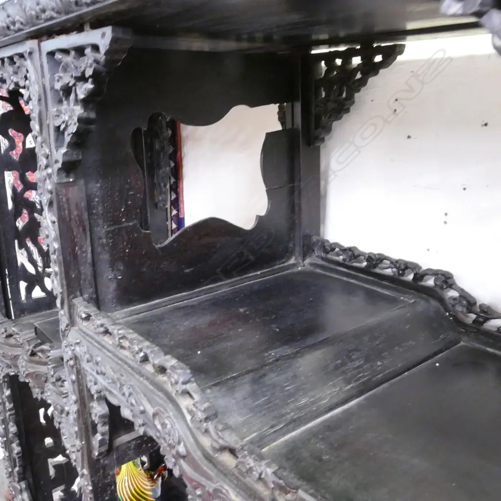 An ornate Chinese blackwood carved display cabinet Image 1++