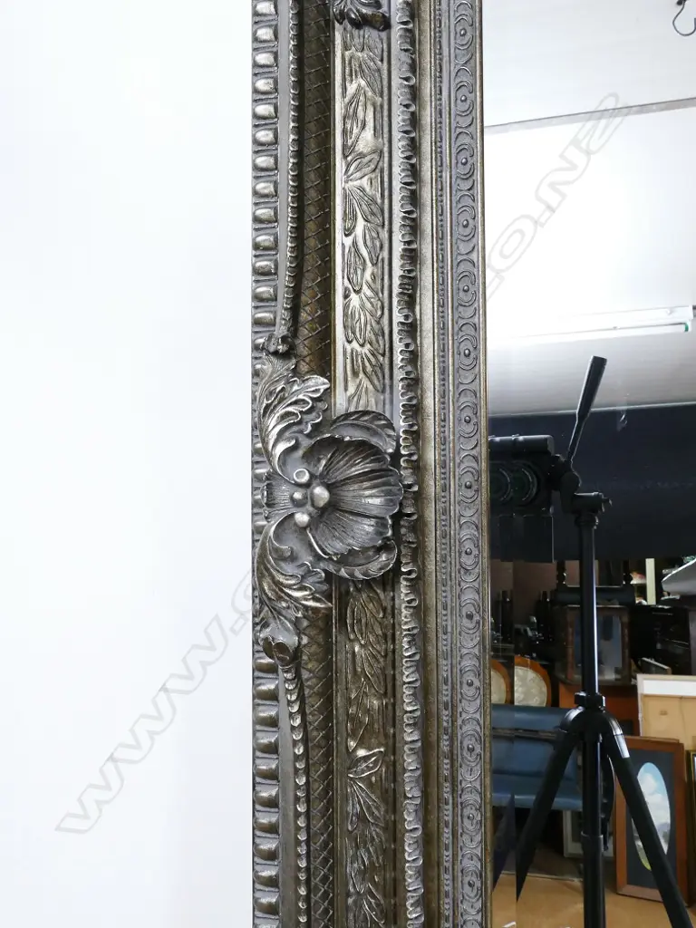 A large and ornate moulded framed overmantel mirror Image 1++