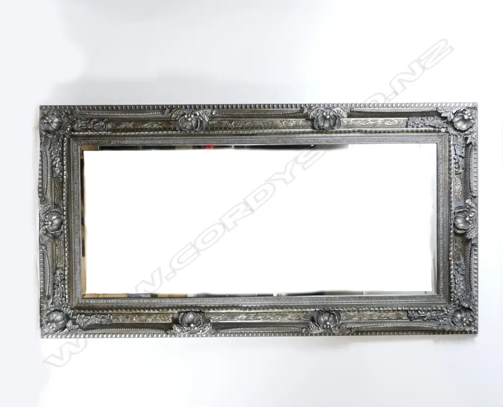 A large and ornate moulded framed overmantel mirror Image 1++